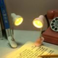Clip-on LED book light being used for night time reading