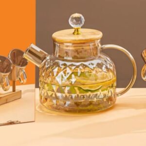 Diamond cut glass jug with wooden lid filled with lemon water