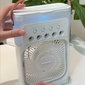 Portable mist cooling fan being used on a desk