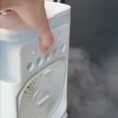 Mist fan spraying fine water mist while running