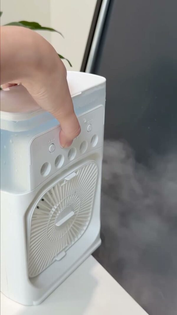 Mist fan spraying fine water mist while running