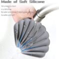 Shell shaped soap holder made of soft silicone under a tap