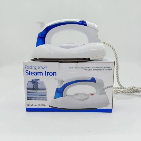 Folding travel steam iron sitting on its retail box Folding travel steam iron sitting on its retail box