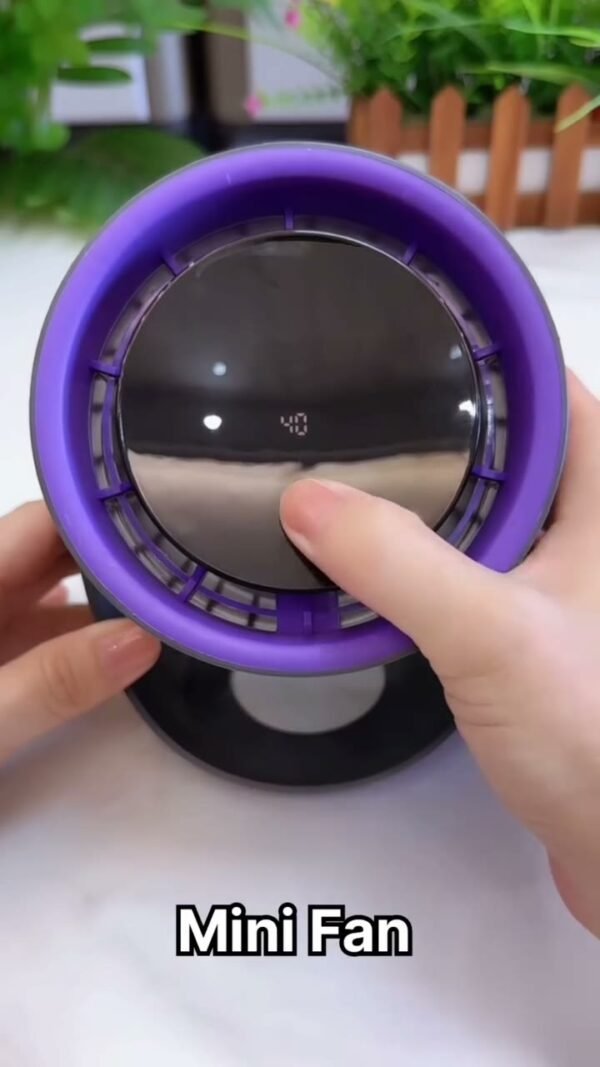 Mini turbo fan being adjusted by hand
