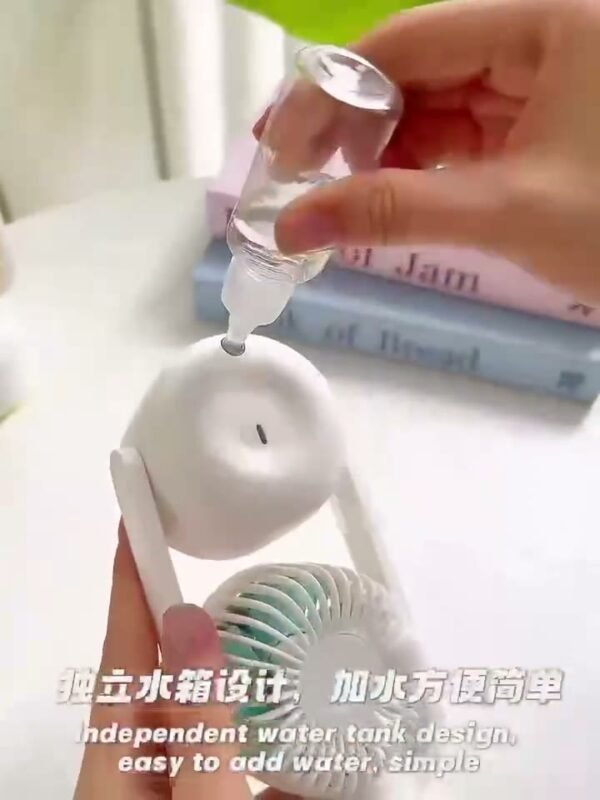 Filling the water tank of the double head mist fan