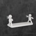 Self adhesive wall shelf with white human figure holders on tiles