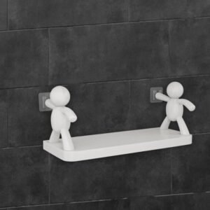 Self adhesive wall shelf with white human figure holders on tiles