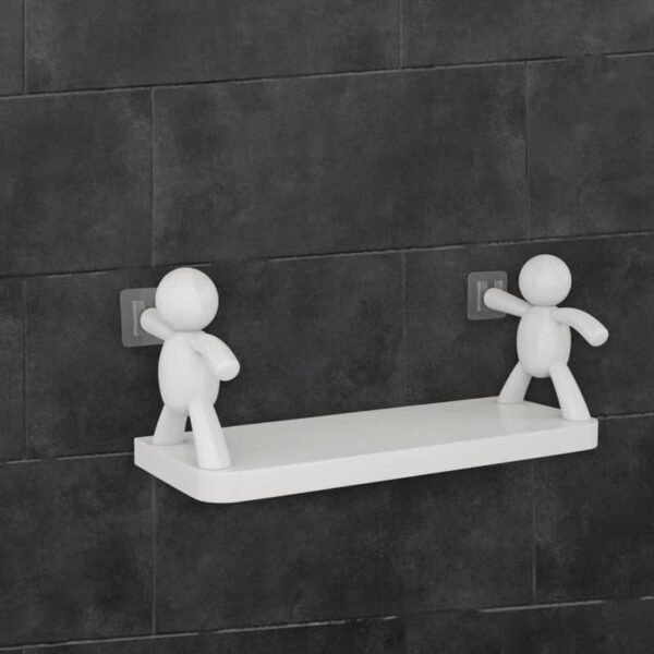 Self adhesive wall shelf with white human figure holders on tiles