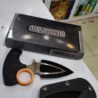Push knife blade and secure sheath laid out with the box