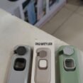 Rotatable child safety locks in grey, white and green with box