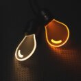 Rechargeable charm bulb glowing in warm white and warm yellow